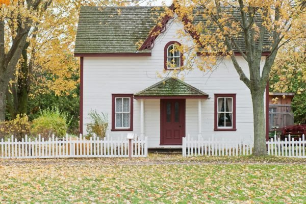 pexels-photo-1029599-1029599 Picturesque traditional house with autumn foliage and a white picket fence in London, Ontario.